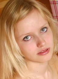 Adorable blond teen posing with no clothes on
